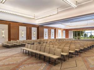 an empty room with rows of chairs in it at Fairmont Taghazout Bay in Taghazout +209 photos