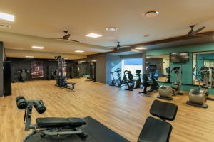 a gym with several treadmills and exercise equipment at Riu Plaza Guadalajara in Guadalajara