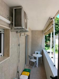 a small room with a table and a table at Casa Vacanze " ORTE " in Otranto