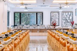 a row of tables in a banquet hall at Catba Vista Hotel - New 2026 - Infinity Pool in Cat Ba +231 photos