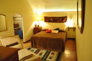 Cama ou camas em um quarto em Onofrio Flat