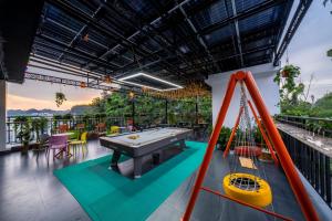 a pool table on the balcony of a house at Catba Vista Hotel - New 2026 - Infinity Pool in Cat Ba