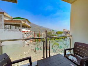 a balcony with a view of a mountain at Mahadevs Mansion in Rishīkesh