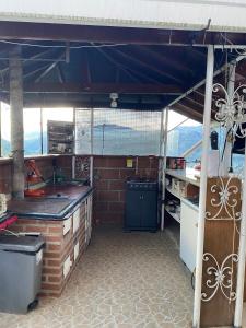 a kitchen with a stove and a counter top at Finca Panoramica in Barbosa