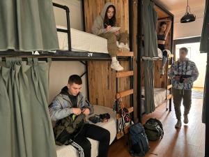 a group of people in a room with bunk beds at Wanderlust District in Mexico City