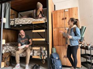 a group of people standing in a bunk bed at Wanderlust District in Mexico City