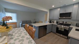 a kitchen and dining room with a table and a kitchen at Rest Haven Motel in Los Angeles +44 photos