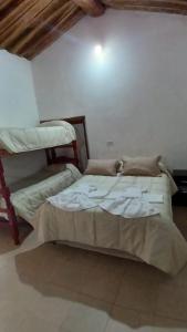 a bedroom with two bunk beds in a room at hospedaje chango luna in Purmamarca