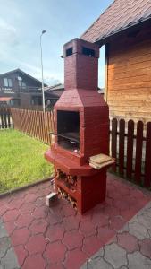 a brick oven sitting on top of a patio at Figa Retreat in Beclean