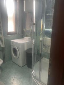 a bathroom with a washing machine and a washer at Hana in Konjic +17 photos
