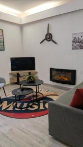 a living room with a couch and a fireplace at L'Atelier du Quai in Mâcon