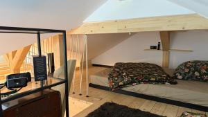 a room with a bed in a loft at Gleisbett 12-2 in Meiningen