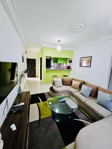 a living room with a couch and a table at Résidence Ephrata in Cocody