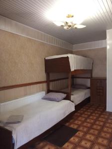 two bunk beds in a room with a ceiling at Vintage in Kotowsk