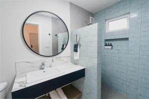 a bathroom with a sink and a mirror at Casa Othir in Monterrey +49 photos