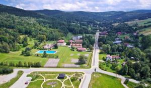 an aerial view of a house with a swimming pool at PIOTROWSKi HOUSE in Ropica Górna