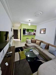 a living room with a couch and a table at Résidence Ephrata in Cocody