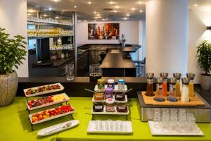 a buffet of food on a table in a restaurant at Hotel am Hirschgarten in Filderstadt