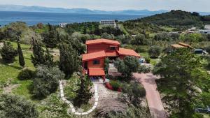 an aerial view of a house with a red roof at The Lodge apartment in Mesongi