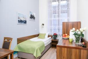 Posteľ alebo postele v izbe v ubytovaní Apartamenty Bonerowska 5