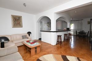a living room with a couch and a table at Hostel Holiday Cetinje in Cetinje