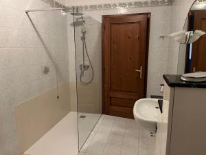a bathroom with a shower and a toilet and a sink at Foresto Case Vacanza in Volta Mantovana +107 photos