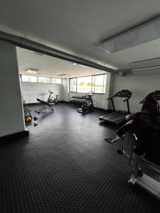 a gym with several exercise bikes in a room at The Safari Launchpad Windhoek in Windhoek
