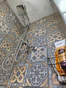 a tiled floor with a cord on a floor at Guest house with sauna in Krčedin +14 photos