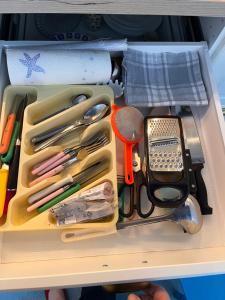 a drawer filled with various utensils in a drawer at Dalmatian rustic house in Petrcane