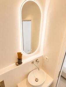 a bathroom with a sink and a mirror at Lodge Narlis in Platis Gialos +46 photos
