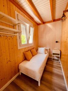 a bed in a small room with a window at Casa Ana & Spa in Conil de la Frontera +37 photos