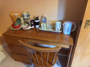 a wooden desk with a tray of food on it at The private Minton Mews No 3 in Bournemouth