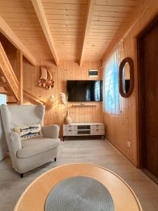 a living room with a couch and a tv at Baltic Star in Władysławowo
