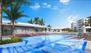 a swimming pool with lounge chairs and palm trees at Apartamento completo no Bérgamo in Feira de Santana