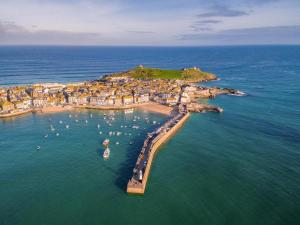 an aerial view of a small island in the ocean at 1 Bed in St Ives oc-crab02 in St Ives