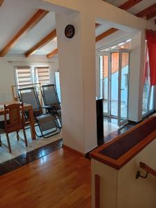 a room with a table and chairs and a dining room at Studio Mare in Kaštela