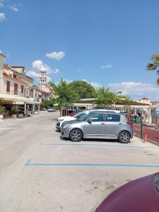 a row of cars parked in a parking lot at Studio Mare in Kaštela