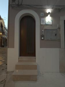 a door of a building with stairs in front at La Chicca di Ameli in San Severo