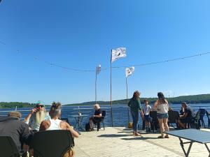 a group of people sitting on the deck of a boat at Chambre b&b in Miraval-Cabardès