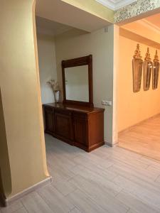 a mirror on a dresser in a room at Erebuni in Yerevan +6 photos