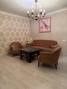 a living room with a couch and a table at Erebuni in Yerevan