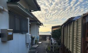 a view of an alley between two buildings at Seaside accommodation - Vacation STAY 22044 in Horiechō
