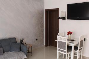 a living room with a couch and a table at Apartments Simun in Kotor