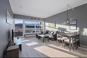 a living room with a table and a couch at Modern apartment with amazing location in Hol
