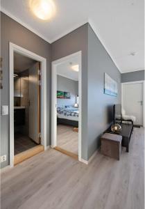 a room with a bedroom with a bed and a mirror at Modern apartment with amazing location in Hol