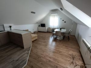 a living room with a table and a dining room at Hotel Guesthouse Stari Jasen in Zagreb