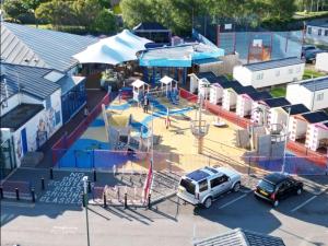an aerial view of a playground with a white truck at J&A Caravan in Rhyl