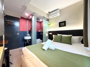 a bedroom with a large bed in a room at A Hotel Chinatown in Singapore