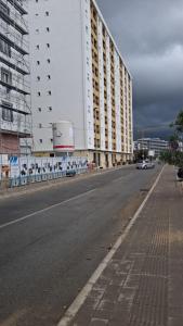 an empty street in front of a large building at Cozy aparment Susanj,Bar in Bar