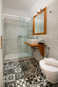a bathroom with a shower and a sink and a toilet at Villa Maritsa, Magazia in Gaios +23 photos